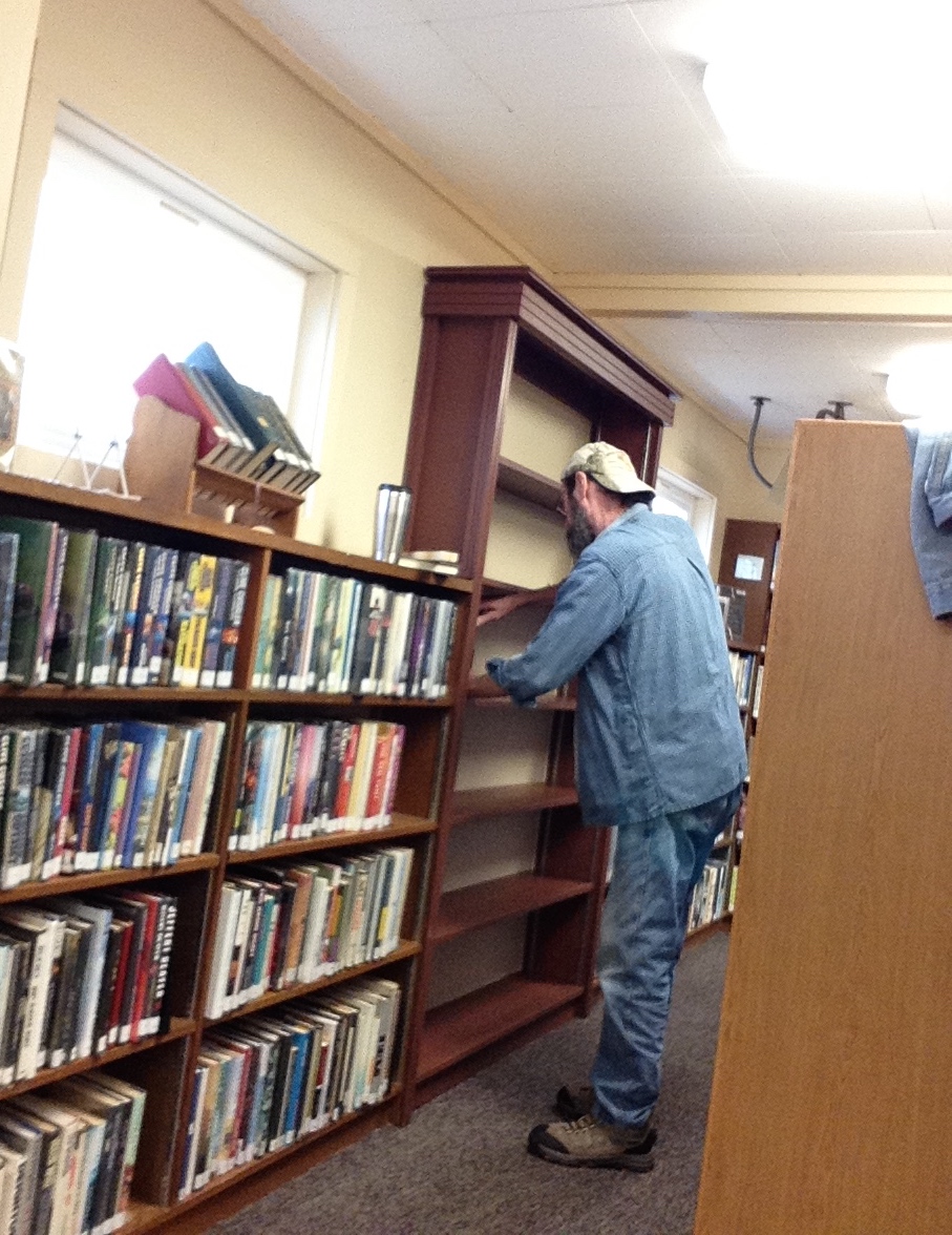 Darrel puts finishing touches on shelves